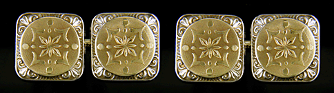 White and yellow 14kt gold cufflinks.